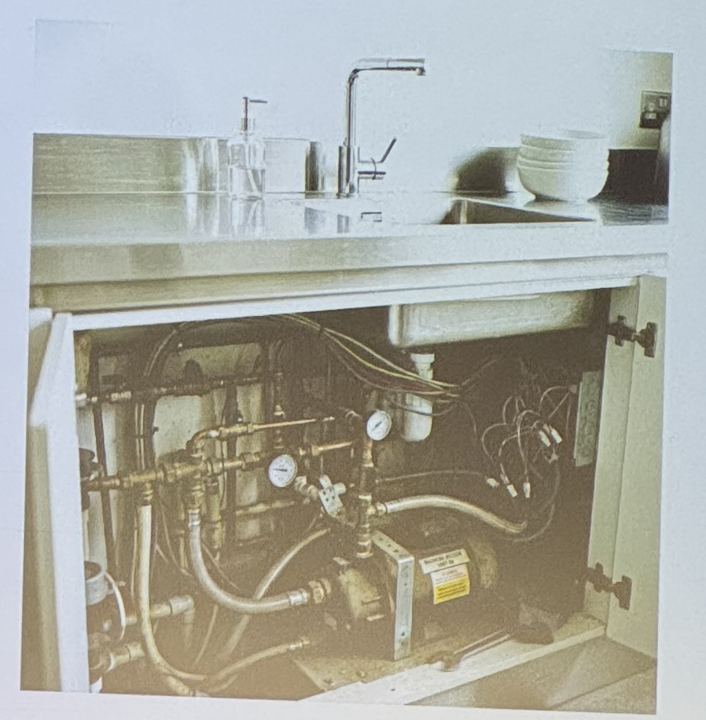 Clean kitchen sink above, tangled plumbing below: the semantic debt metaphor